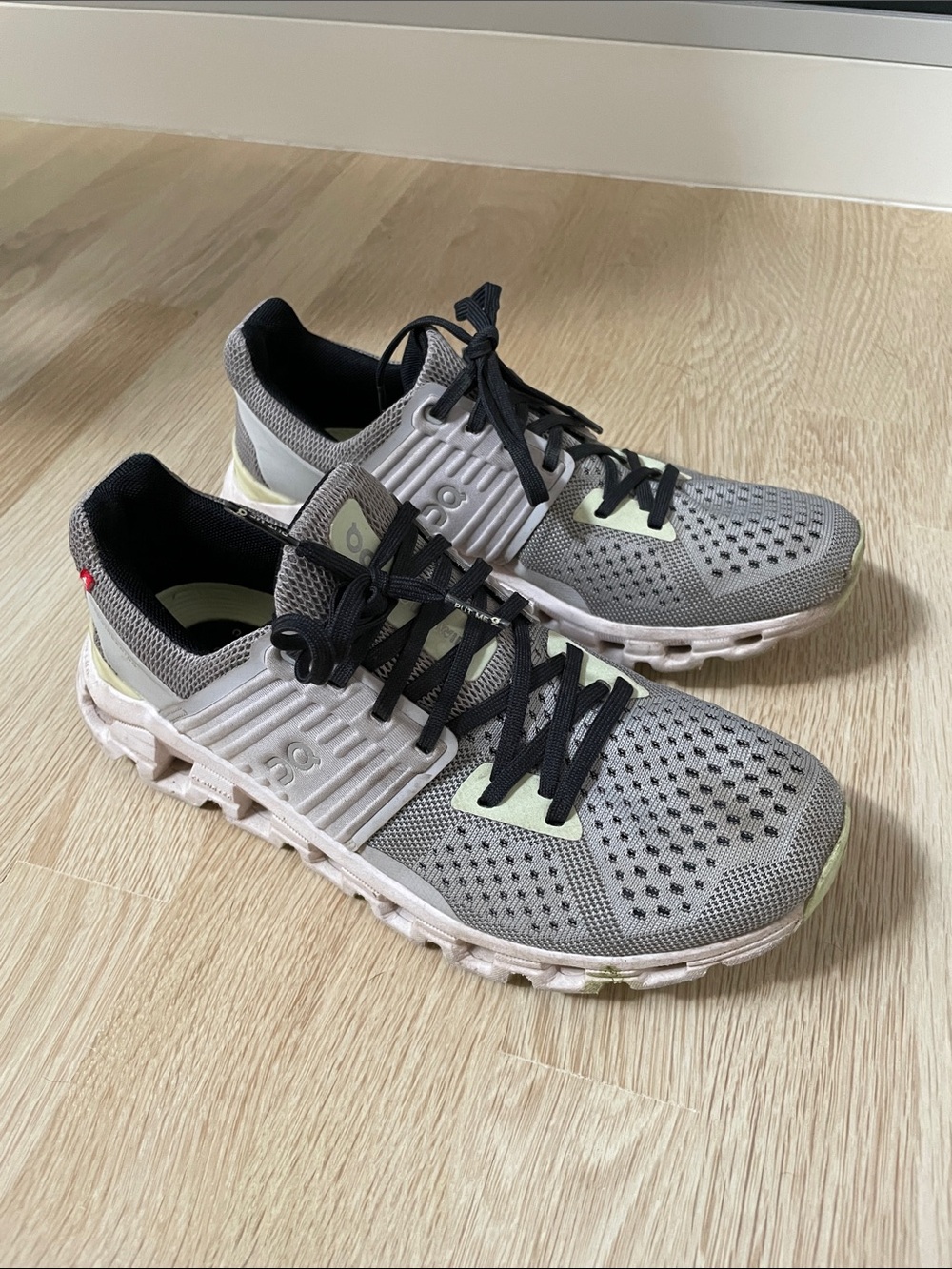 On Running Cloud Sneakers in Gray with Black Laces and Pale Yellow Accents